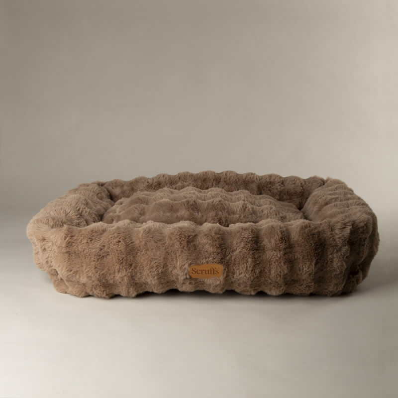 Scruffs Alpine Box Bed Taupe has raised edges, a cushioned interior, and is machine washable.