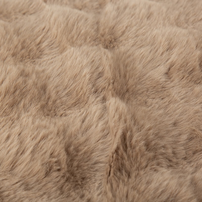 Close-up of Scruffs Alpine Mattress Taupe soft faux fur fabric texture.