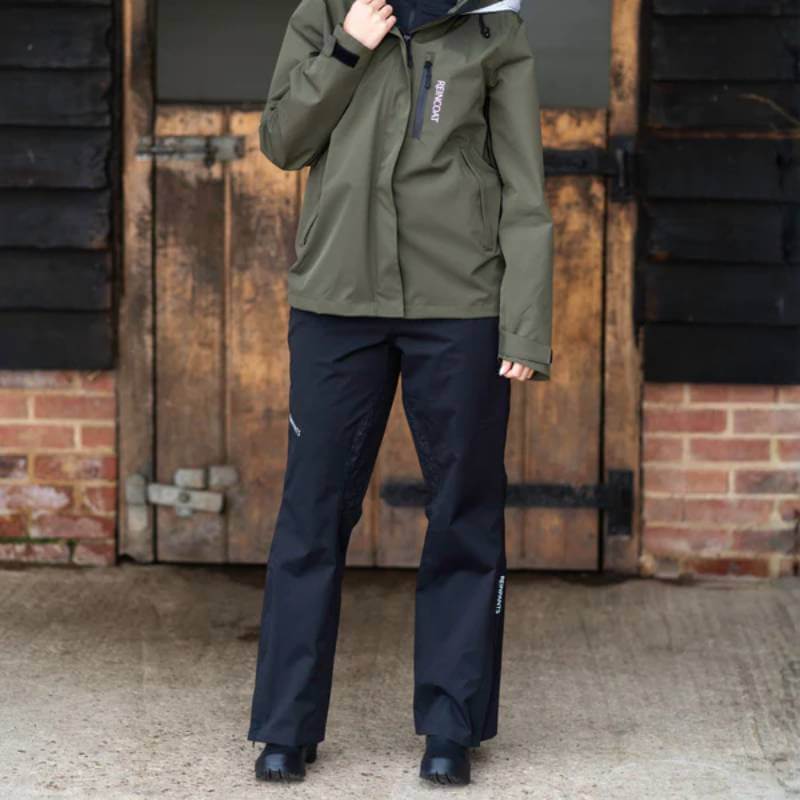 Reinwear Reinpants Lite Black: lightweight rain pants with zip pockets on white background.