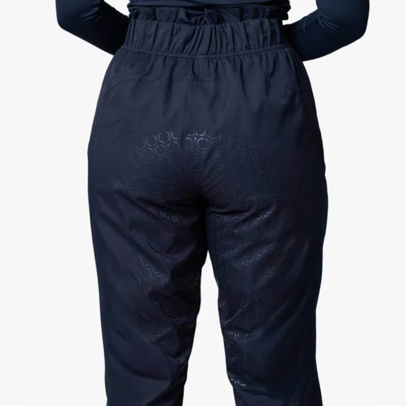 Person in Reinwear Reinpants Lite Black, breathable waterproof pants, shown from behind.