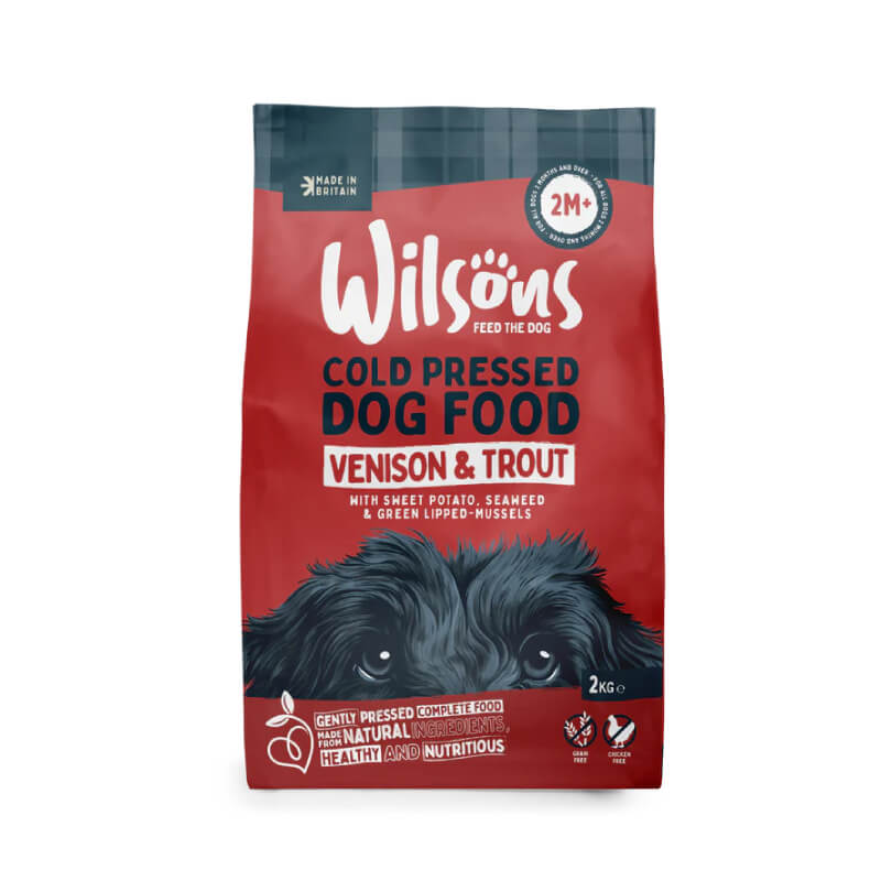 Wilsons Venison & Trout dog food—grain free, red/blue bag with dog illustration.