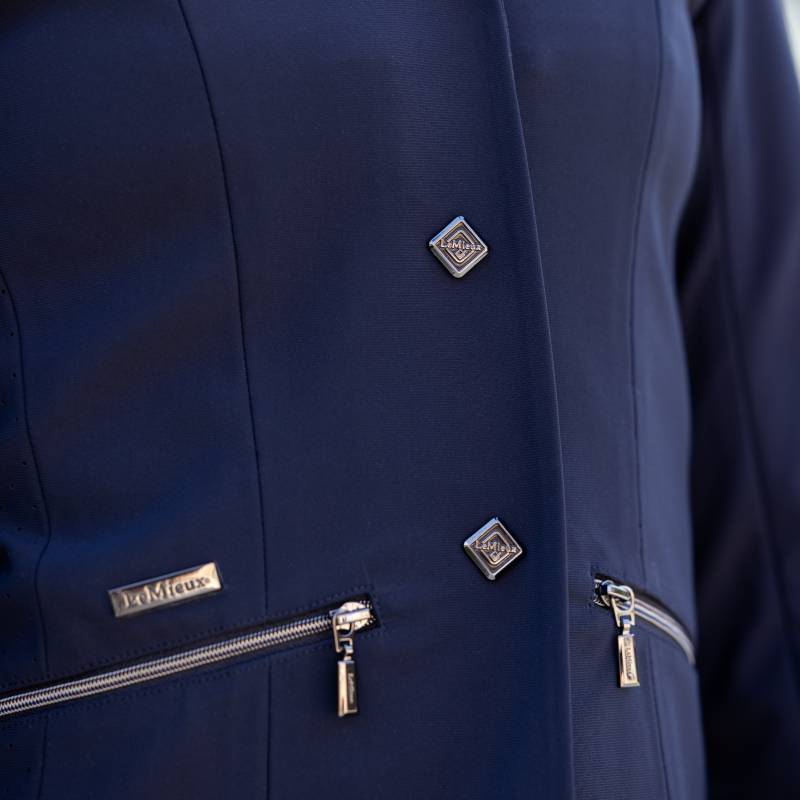 LeMieux Junior Pro Show Jacket Navy with silver buttons and zippered pockets.