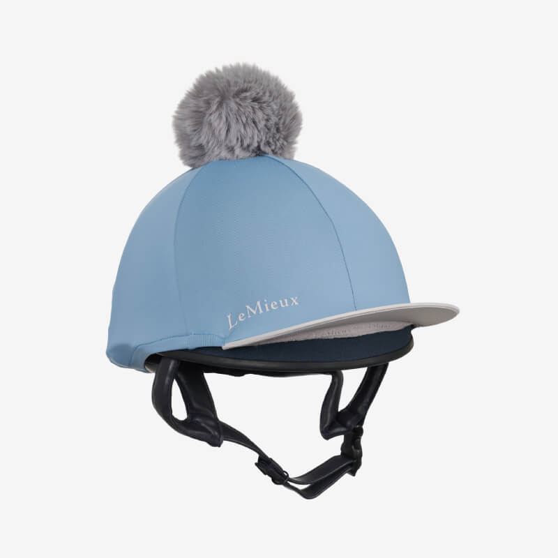 LeMieux Classique Pom Hat Silk in Ice Blue with gray pom-pom and LeMieux branding.