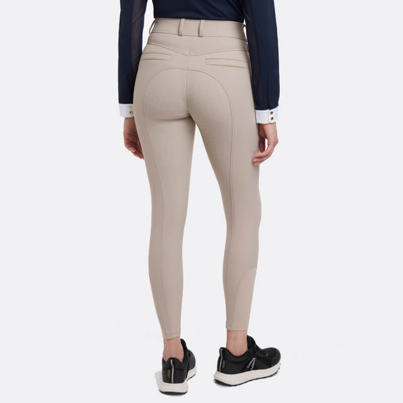 Person wearing LeMieux Isabelle Full Seat Breeches Almond by LeMieux, shown from the back.