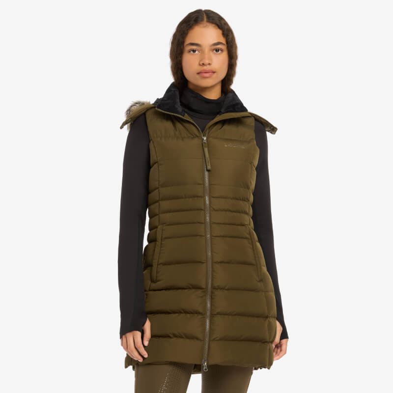Woman in LeMieux Harper Longline Puffer Gilet Alpine with lightweight DuPont Sorona filling.