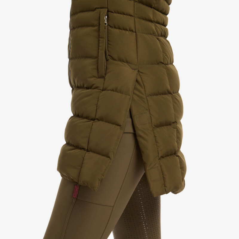 Side view of LeMieux Harper Longline Puffer Gilet Alpine with detachable hood and DuPont Sorona fill.