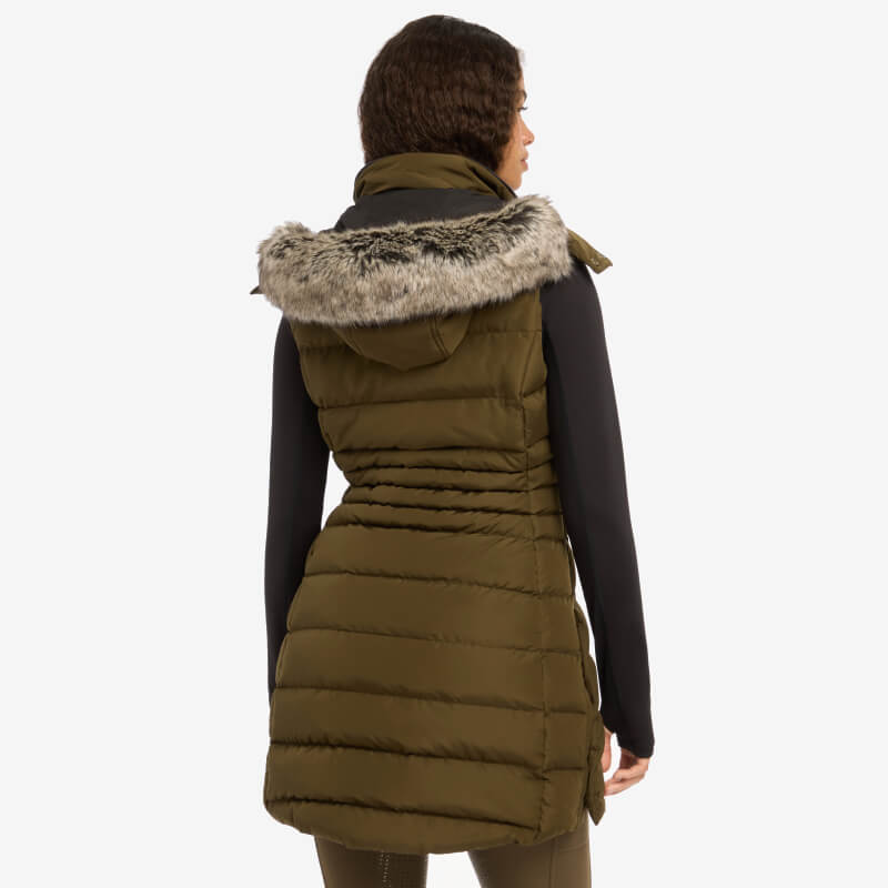 Woman in a LeMieux Harper Longline Puffer Gilet Alpine with lightweight DuPont Sorona filling.