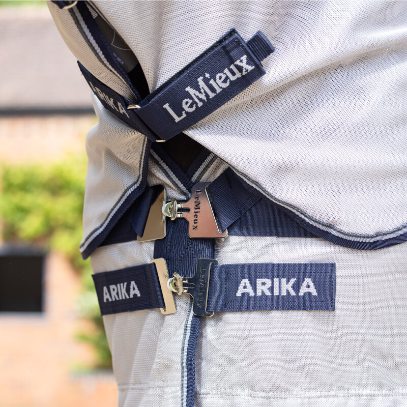 Close-up of LeMieux Arika Armour-Tek Fly Rug Grey showing buckles and branded name tags.