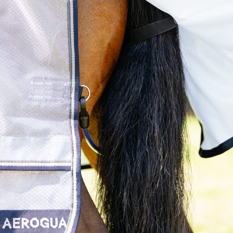 Close-up of a horse's tail and LeMieux Kudos AeroGuard Fly Rug Silver with logo visible.