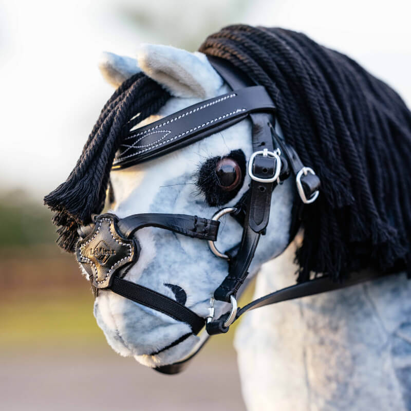 LeMieux Toy Pony Grackle Bridle Black—adjustable leather bridle with metal rings, white stitching.