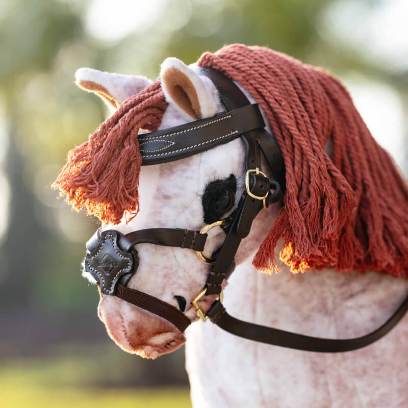 LeMieux Toy Pony Grackle Bridle Brown by LeMieux with brass buckles and white stitching.