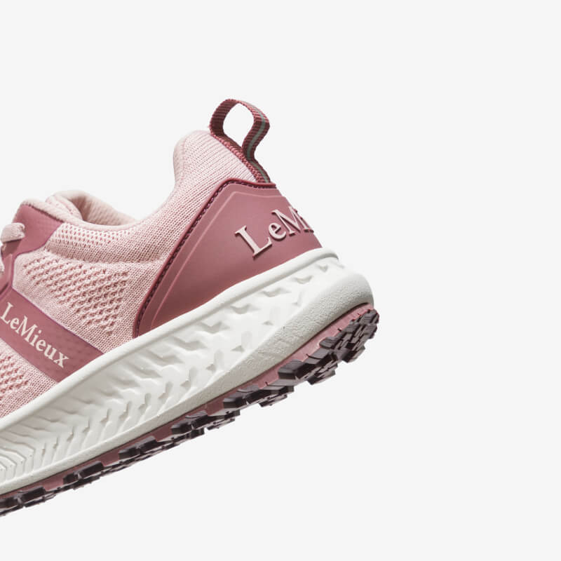 LeMieux Youth Trax-Lite Trainer Blossom in pink and white, shown on a white background.