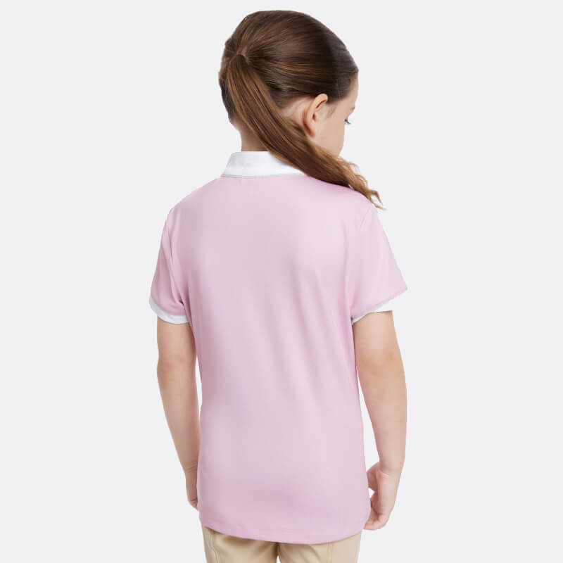A girl with brown hair wears a LeMieux Mini Bella Show Shirt Blossom, back facing the camera.