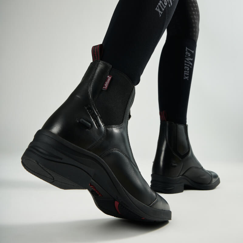 LeMieux Adults Zip Paddock Boot Black paired with black riding leggings.