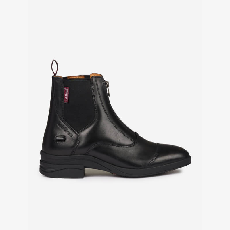 LeMieux Adults Zip Paddock Boot Black features a side zipper and low heel, shown in profile.
