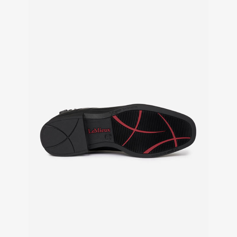LeMieux Adults Zip Paddock Boot Black features a black sole with red accents on white background.