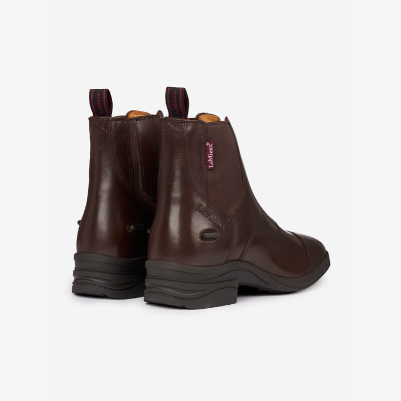 LeMieux Adults Zip Paddock Boot Brown, shown from back and side angles with black soles.