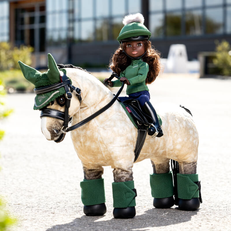 LeMieux Toy Rider Maya doll wears matching green LeMieux accessories and riding gear.