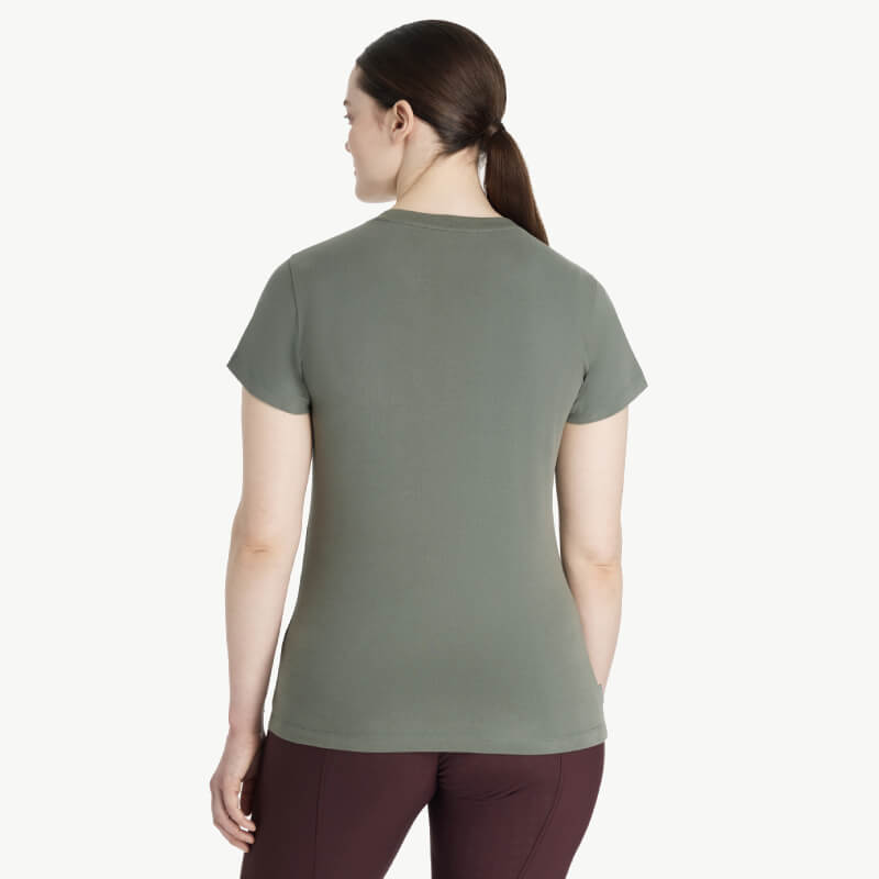 Woman with brown hair in ponytail wearing LeMieux Classique Sparkle T-Shirt Rosemary, seen from behind.