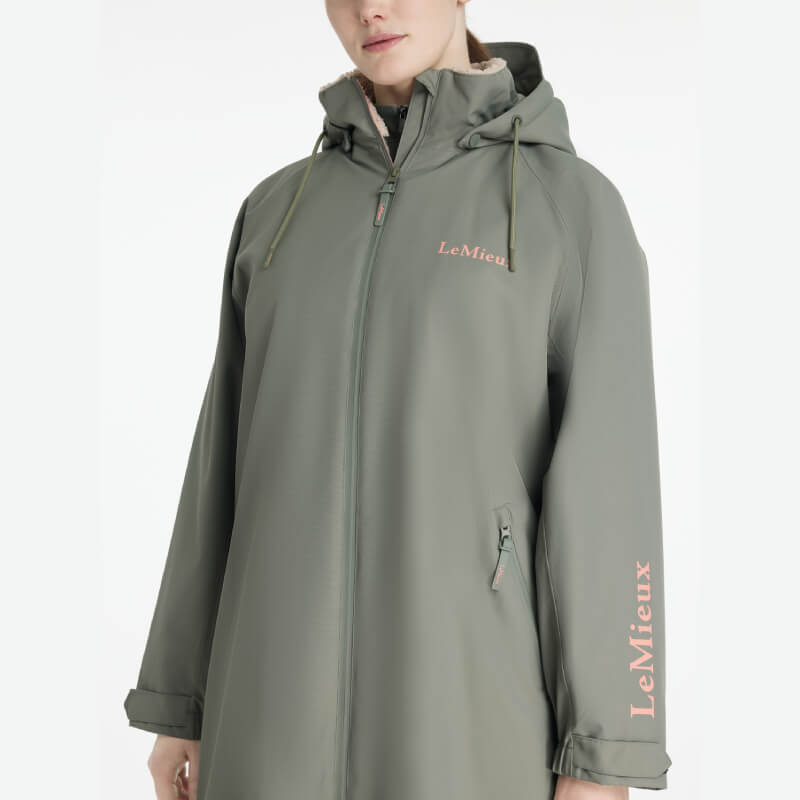 Person wearing a LeMieux Hydroshield Robe Rosemary, standing against a plain white background.