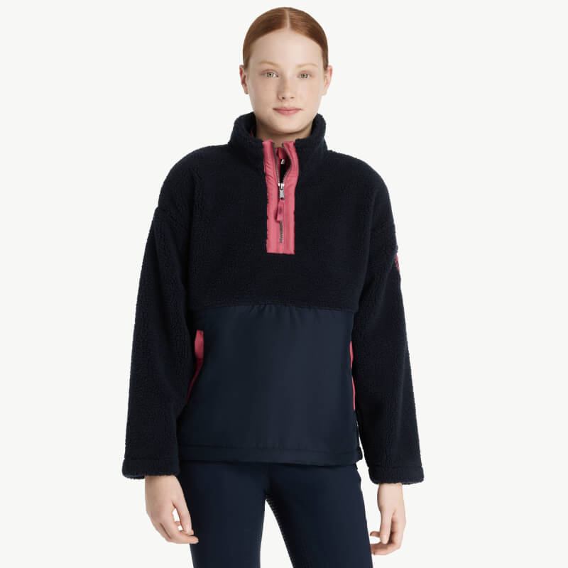 Girl and horse in matching LeMieux Young Rider Tammy Teddy Fleece Navy outdoors.