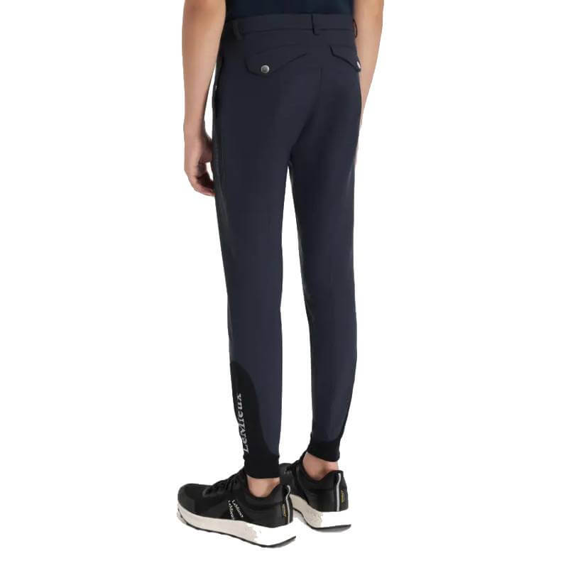 Person in LeMieux Young Rider Boys Classique Breech Navy, standing against a white background.