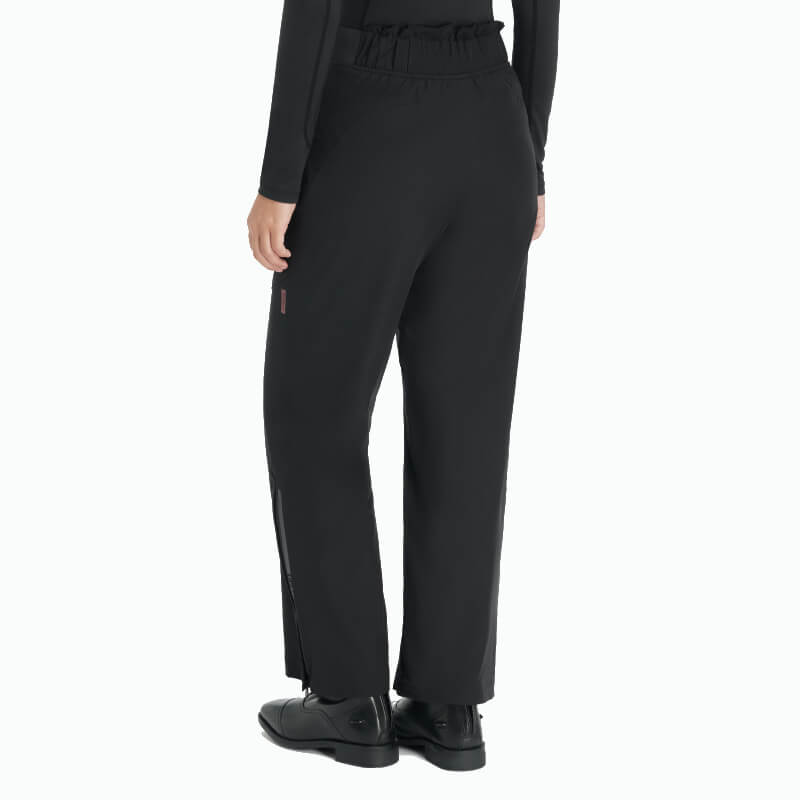 Person wearing LeMieux Young Rider Drytex Stormwear Trousers in black, shown from the back.
