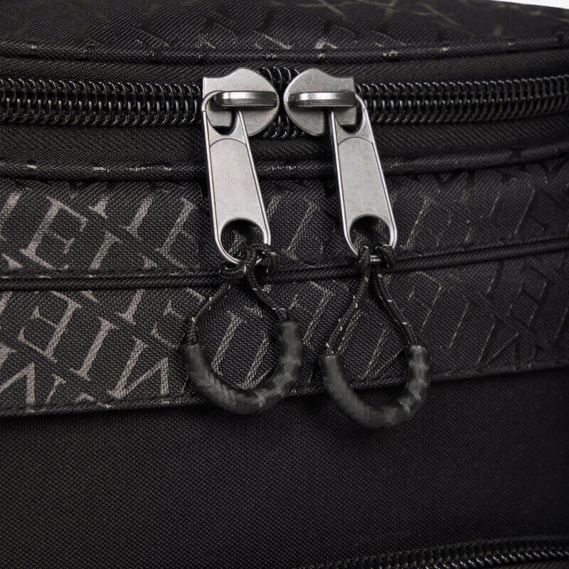 Close-up of two silver zippers on the LeMieux Elite ProKit Lite Grooming Bag in Black.