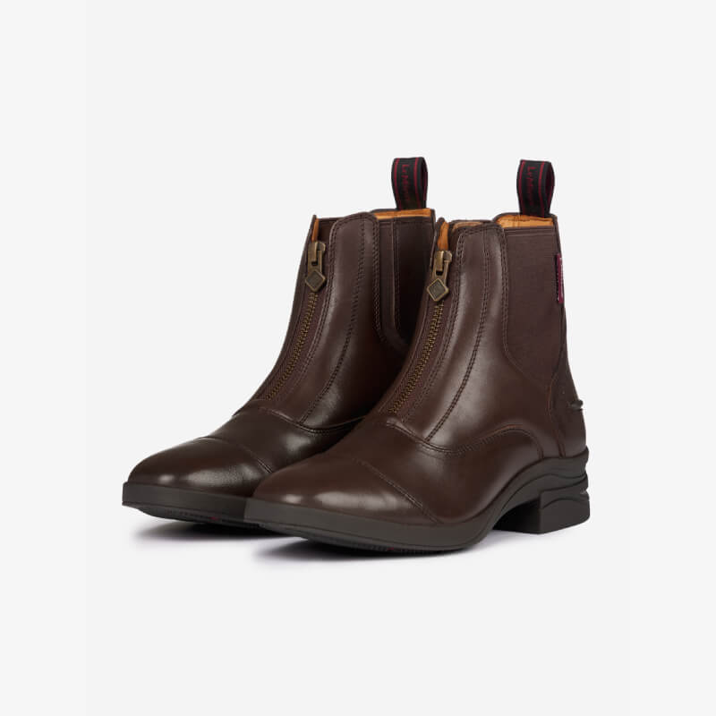 LeMieux Junior Zip Paddock Boot Brown: brown leather boots with front zips and pull tabs.