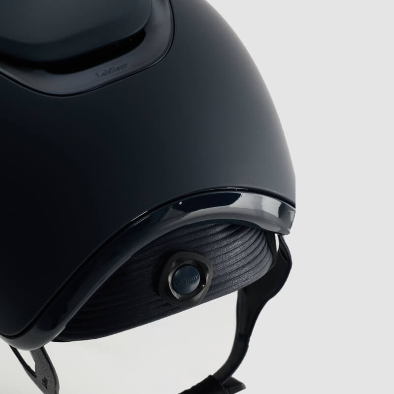 LeMieux Verv® Competition Helmet Matte Navy offers rider protection with a secure chin strap.