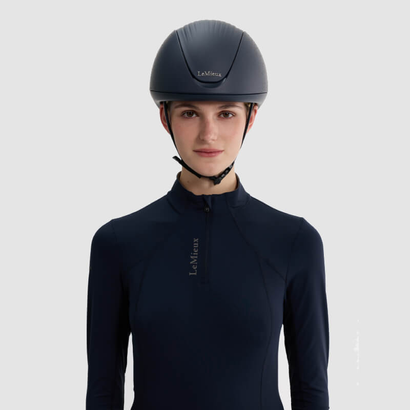 Person wearing the LeMieux Vexa® Skull Helmet Navy, facing forward against a light background.