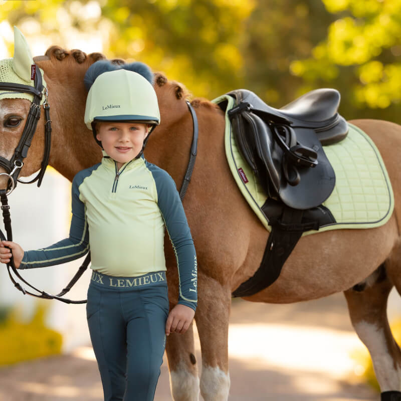 Light yellow LeMieux Mini Suede Close Contact Square Macaron with black and gray trim.