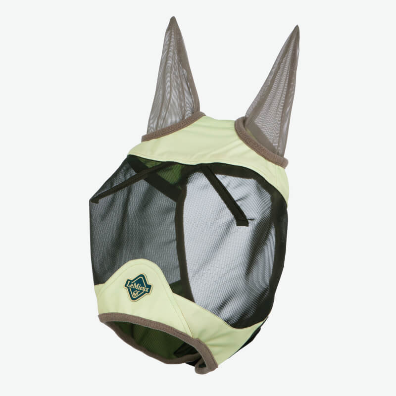 Horse in LeMieux Visor-Tek Half Fly Mask Macaron, outdoors with a blurred background.