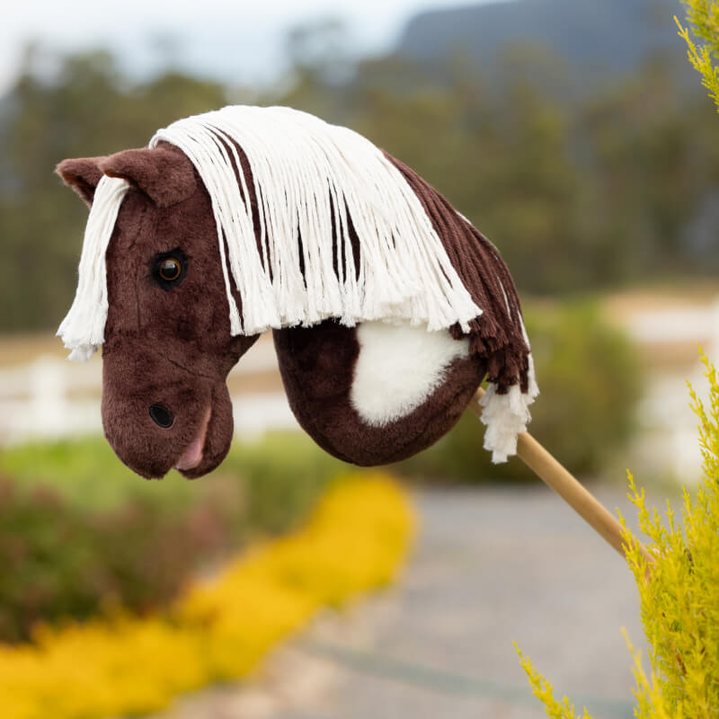 LeMieux Hobby Horse Dazzle—brown/white, outdoors with plaitable mane and realistic design.