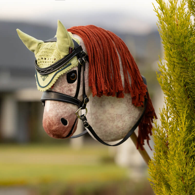 LeMieux Hobby Horse Fly Hood Macaron in light yellow with crochet detail and front logo.