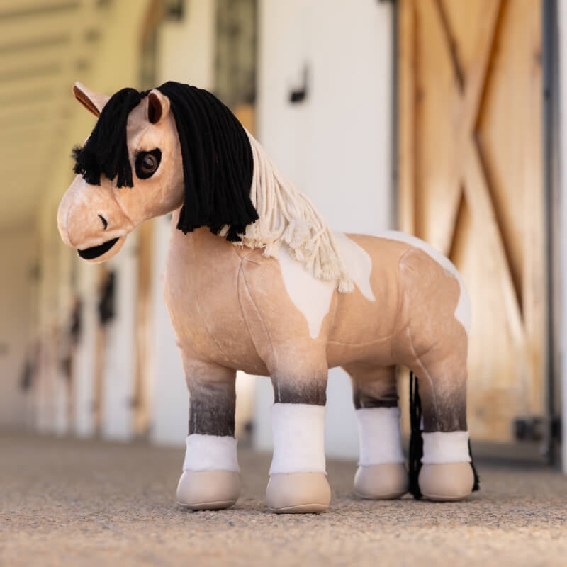 LeMieux Toy Pony Toby: beige body, white legs, black plaitable mane. Stands upright.