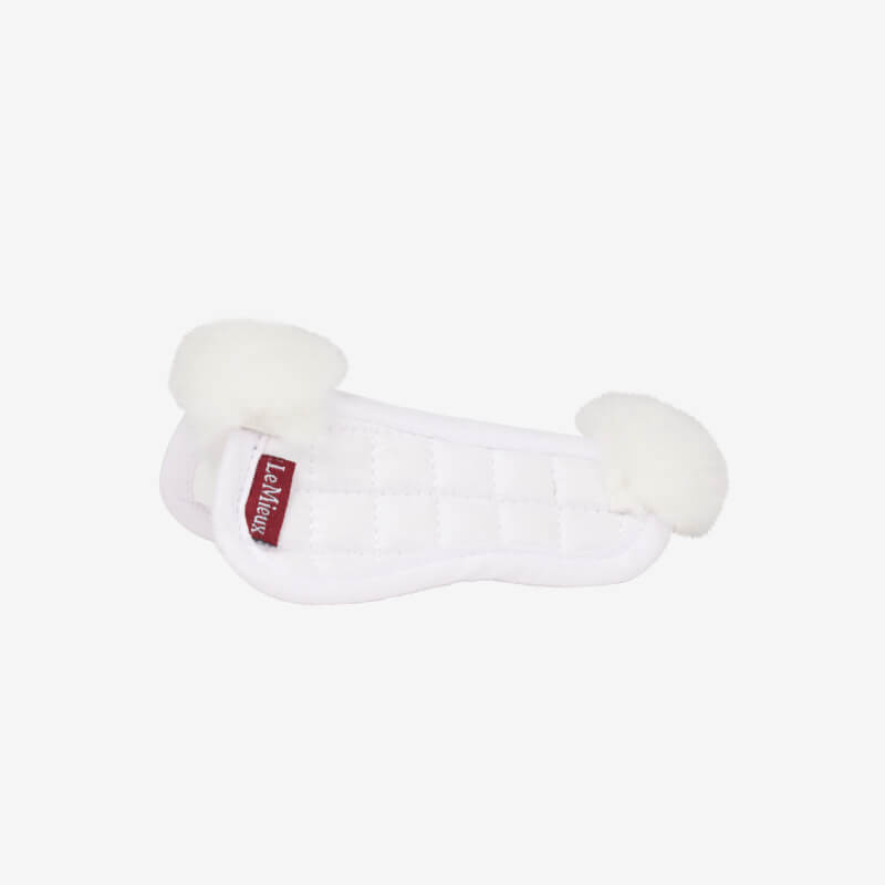 LeMieux Toy Pony Merino Half Pad White, quilted with fluffy ends and red tag, on white background.