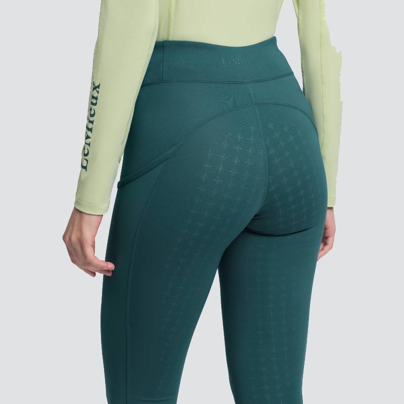 Person in LeMieux Naomi Pull On Breech Jungle and a light green long sleeve, seen from behind.