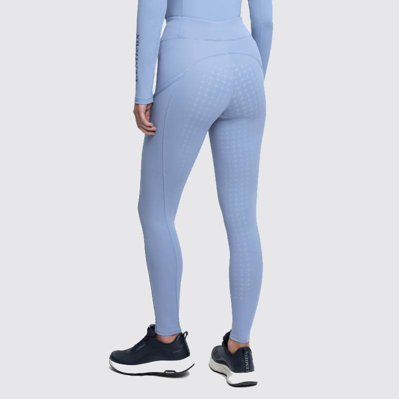 Person in LeMieux Naomi Pull On Breech Powder Blue and sneakers, seen from the back.