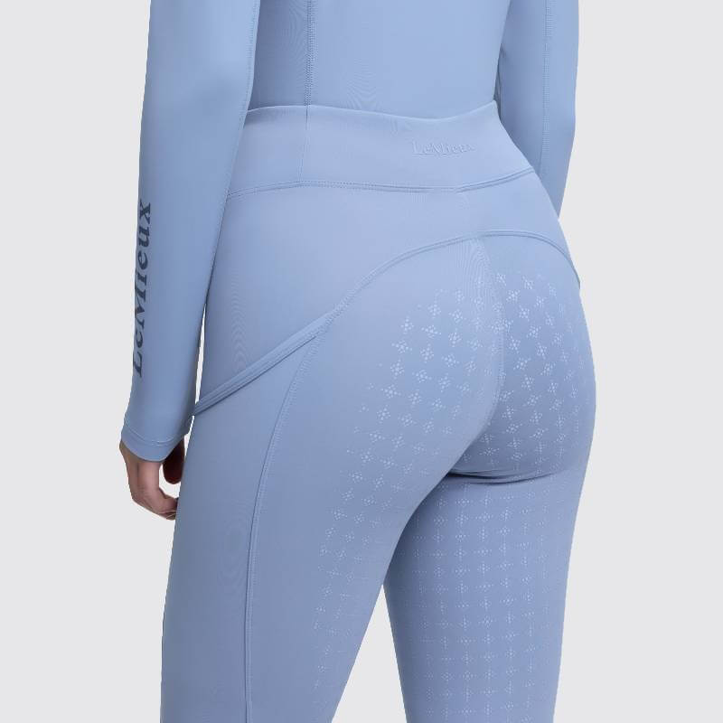 Person in LeMieux Naomi Pull On Breech Powder Blue, back view, patterned leggings.
