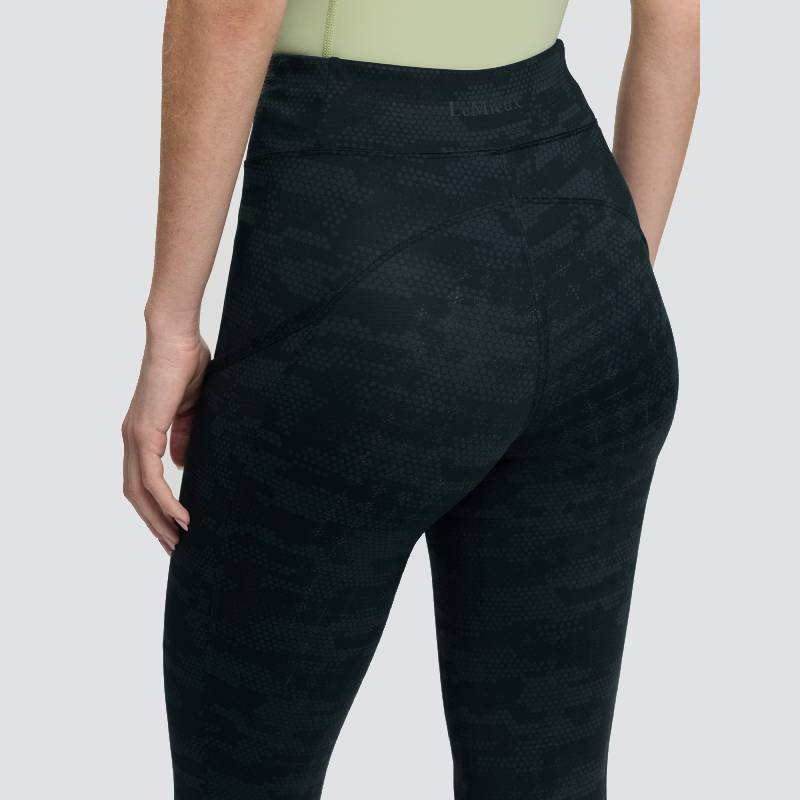 Person in LeMieux Naomi Pull On Breech Camo Black and light green top, shown from the back.