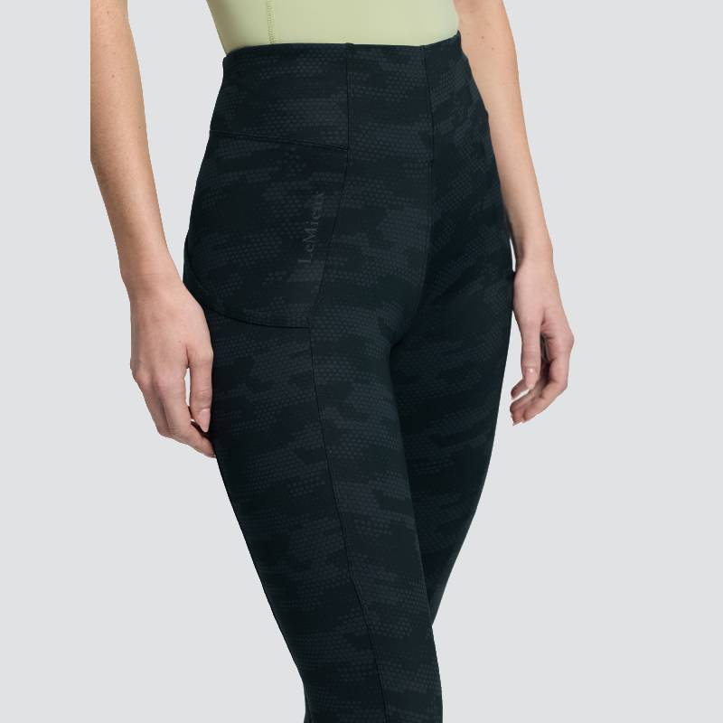 Model wears LeMieux Naomi Pull On Breech Camo Black and a light green top, shown waist down.