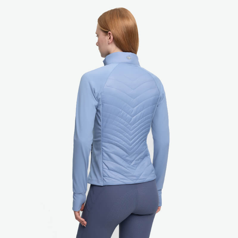 Woman with red hair in a LeMieux Juliette Jacket Powder Blue, seen from behind.
