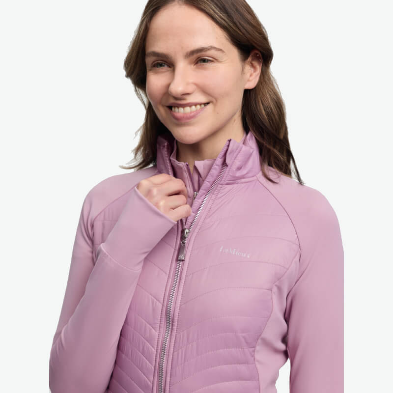 Woman smiling in a LeMieux Juliette Jacket Fondant against a plain white background.