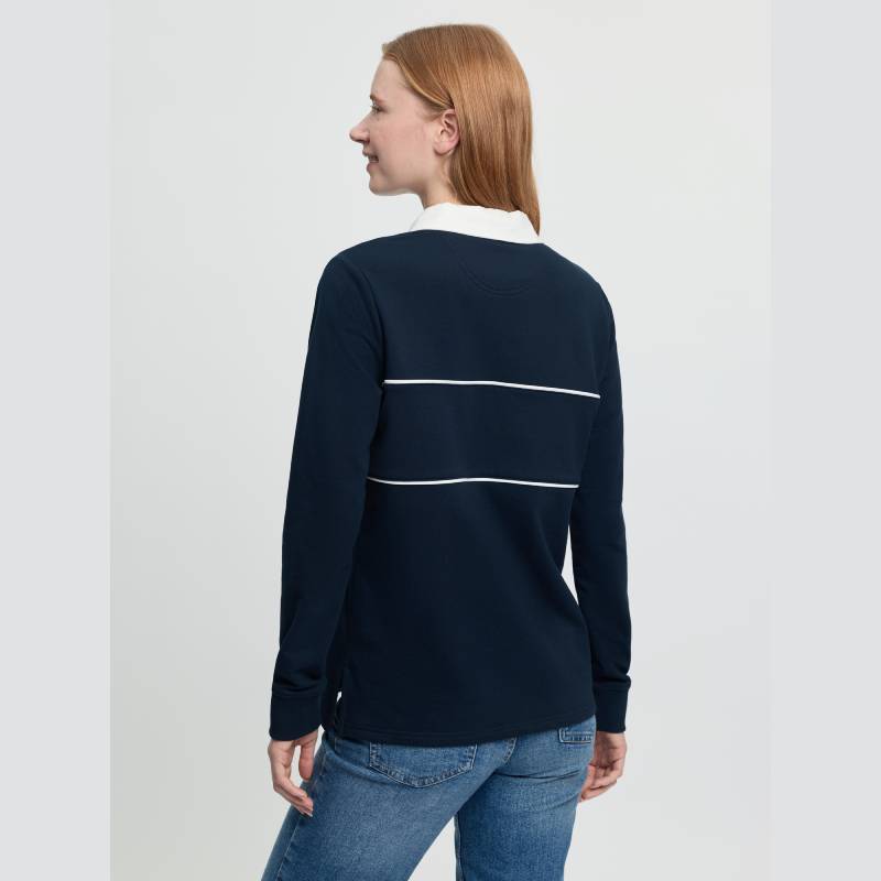 Woman smiling, seen from the back, in a LeMieux Rochelle Rugby Shirt Navy.