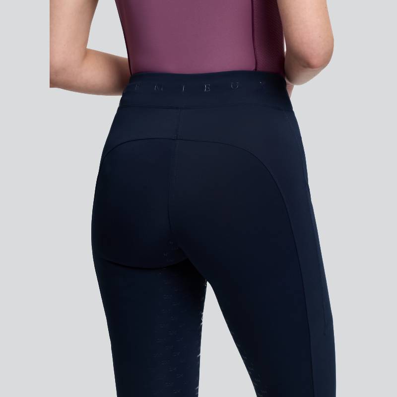 LeMieux Simone Cross Over Half Seat Pull On Navy tights with side pockets on a gray background.
