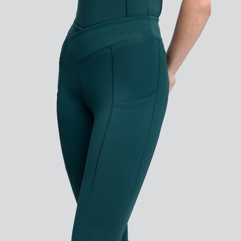 Wearing LeMieux Simone Cross Over Half Seat Pull On Jungle leggings, shown from hip down.