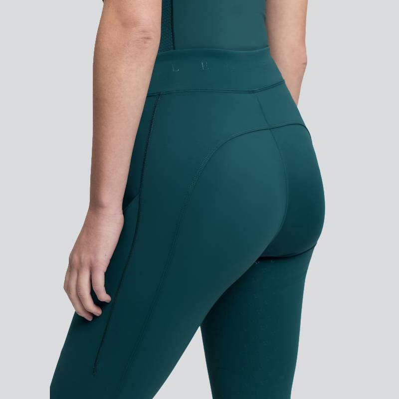 Person wears LeMieux Simone Cross Over Pull On Jungle, shown side and back on plain background.