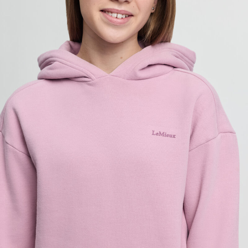 Smiling person in a LeMieux Young Rider Sia Hoodie Fondant, cropped at the shoulders.