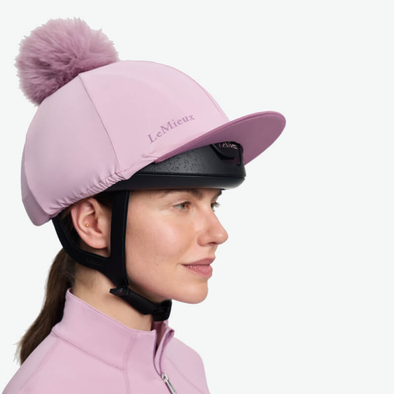 LeMieux Classique Pom Hat Silk Fondant in pink with faux fur pom and secure chin strap.